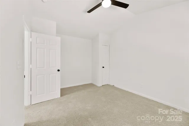 an empty room with fan