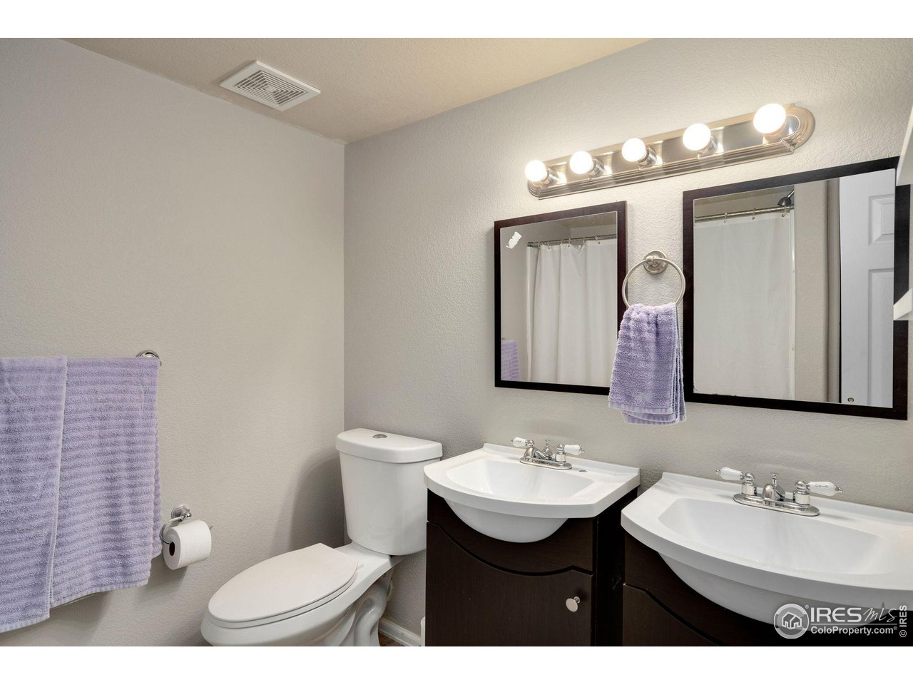 93 Summit View Road Severance, CO 80550 - Photo 18 of 27 a bathroom with a sink toilet a mirror and shower