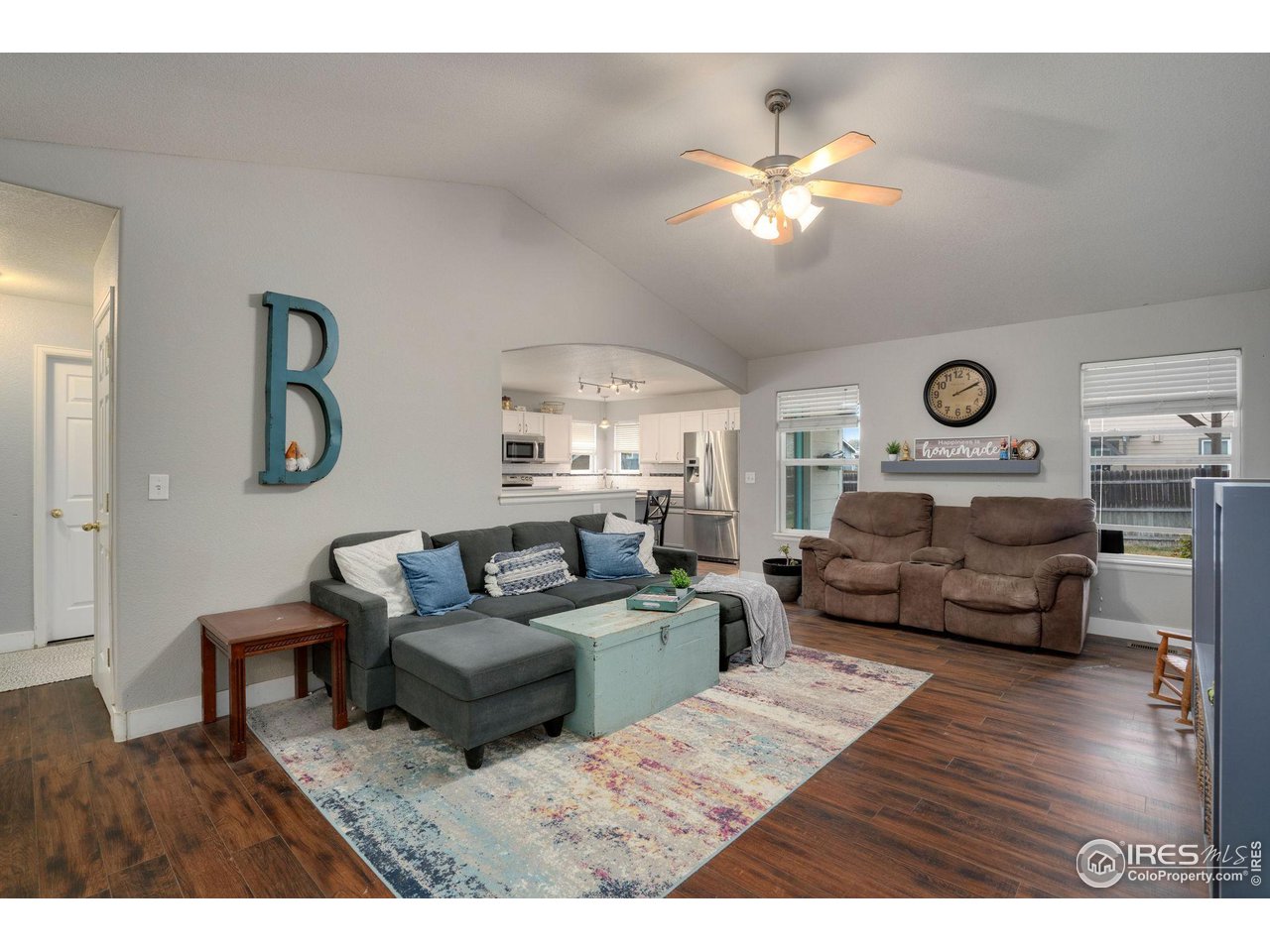93 Summit View Road Severance, CO 80550 - Photo 27 of 27 a living room with furniture and a wooden floor