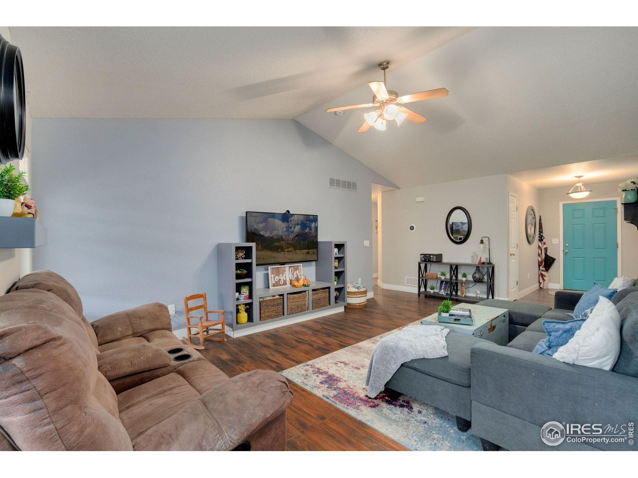 93 Summit View Road Severance, CO 80550 - Photo 4 of 27 a living room with furniture and a flat screen tv