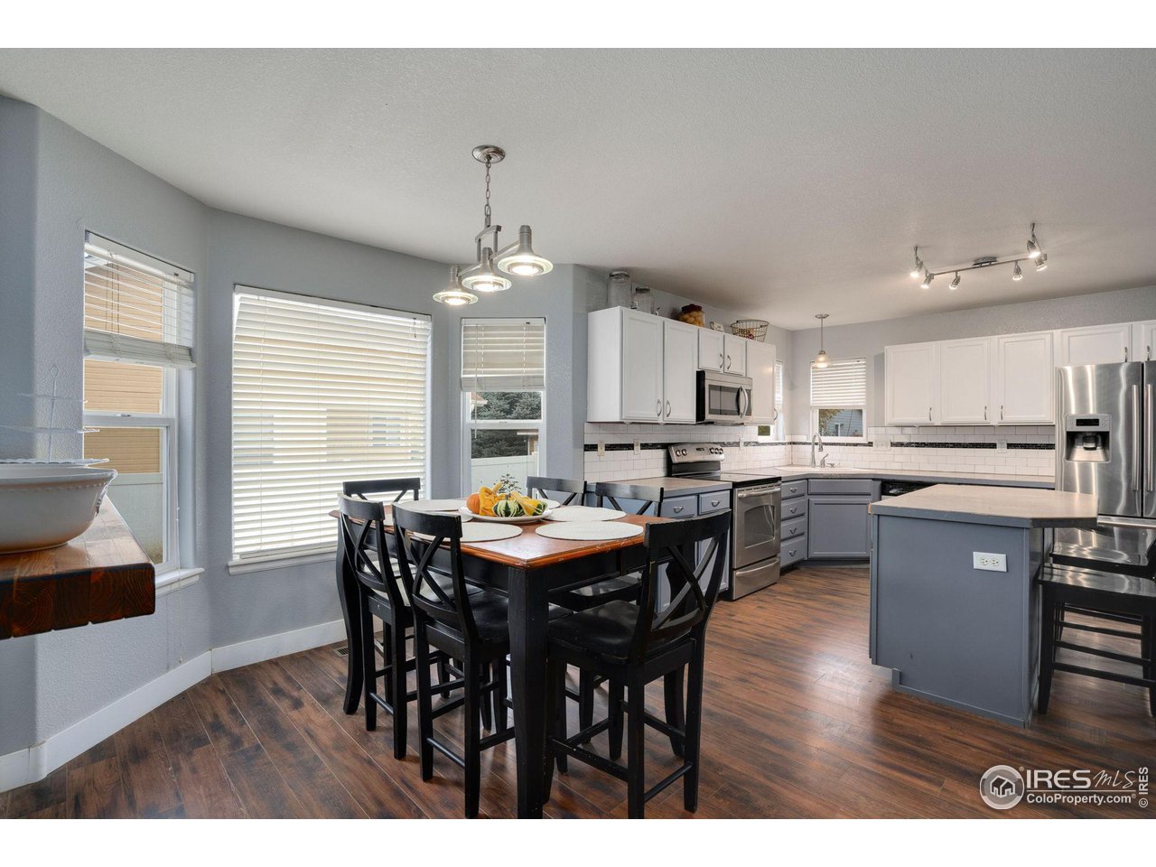 93 Summit View Road Severance, CO 80550 - Photo 5 of 27 a view of a dining room with furniture window and wooden floor