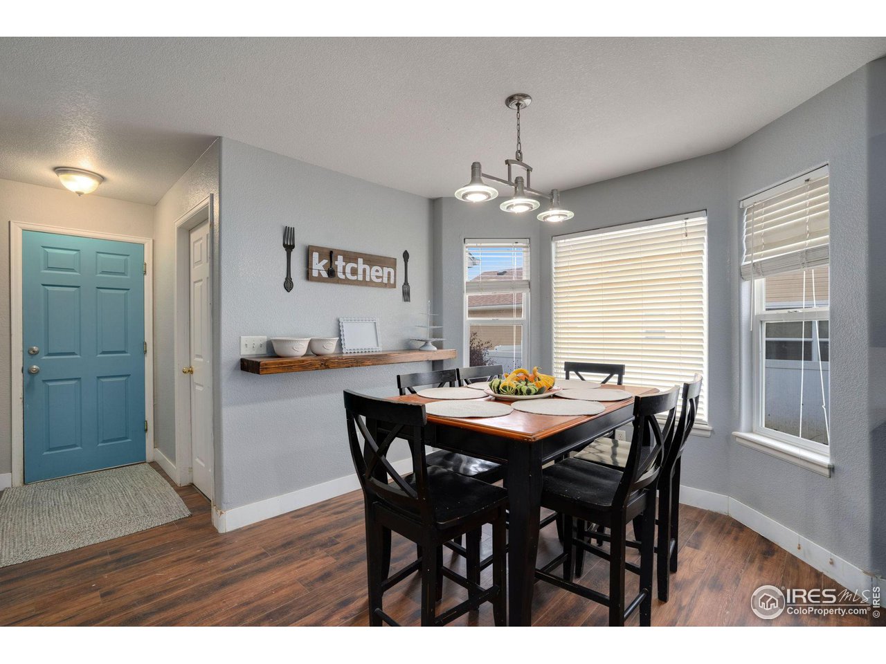 93 Summit View Road Severance, CO 80550 - Photo 6 of 27 a view of a dining room with furniture window and wooden floor