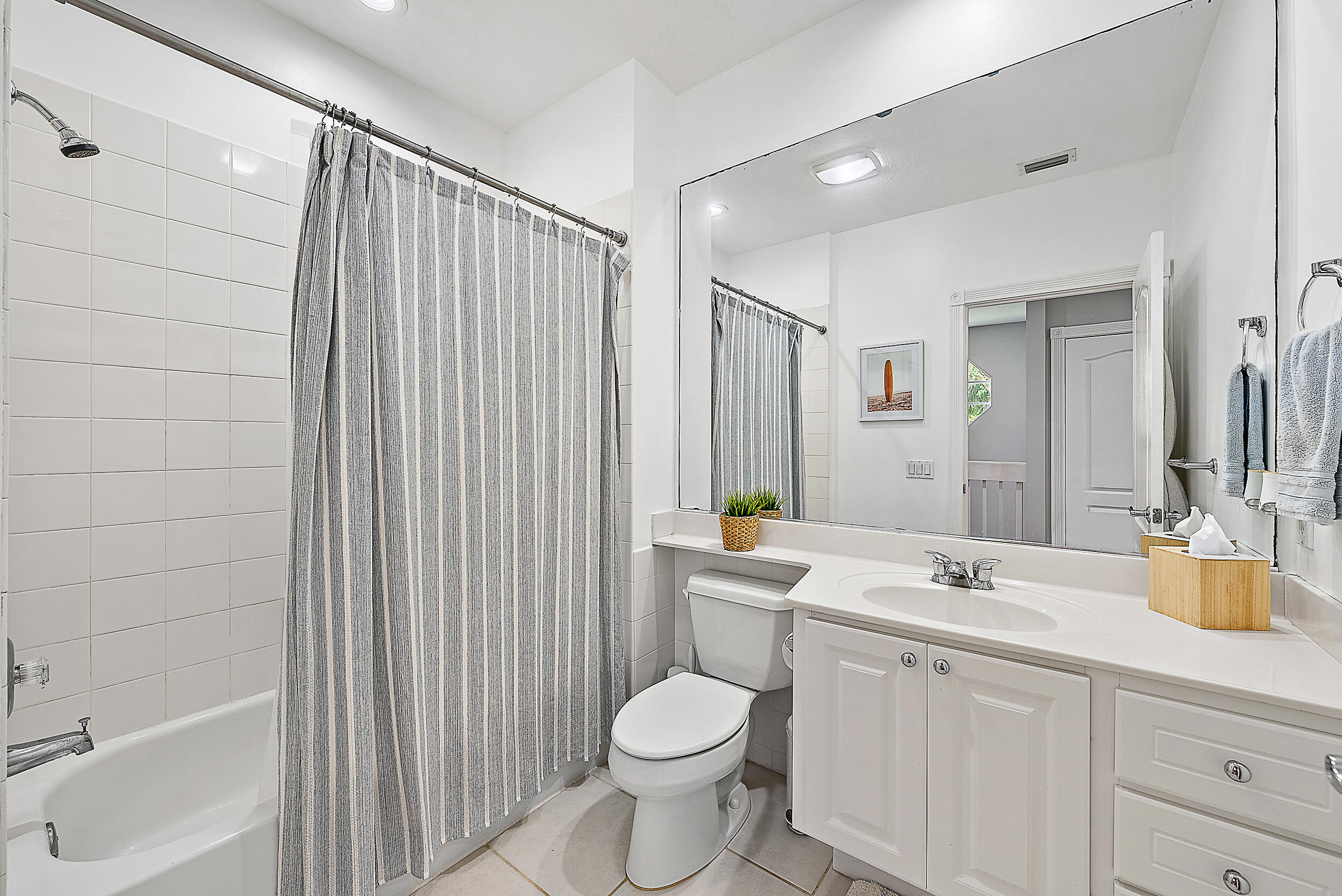 107 Rivinia Drive Jupiter, FL 33458 - Photo 11 of 28 a bathroom with a sink toilet and shower