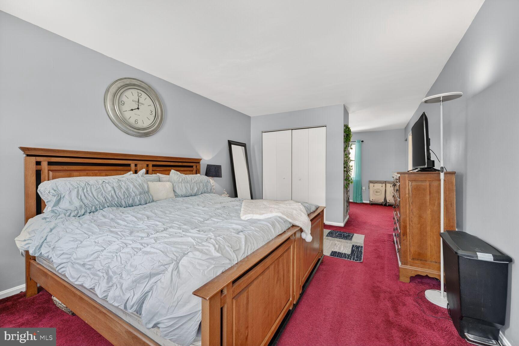 13305 Pendleton Street Fort Washington, MD 20744 - Photo 19 of 28 Spacious primary bedroom with cozy ambiance.