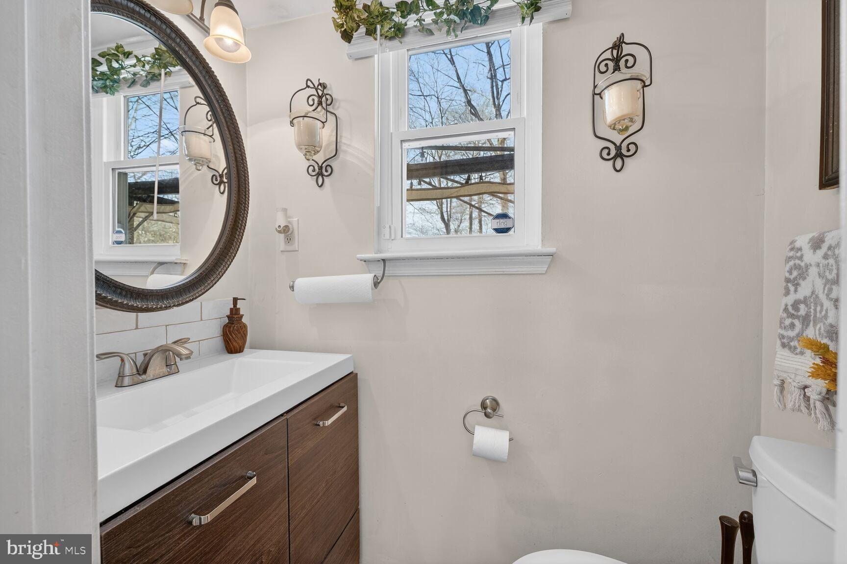 13305 Pendleton Street Fort Washington, MD 20744 - Photo 10 of 28 Half bathroom with natural light on main level.
