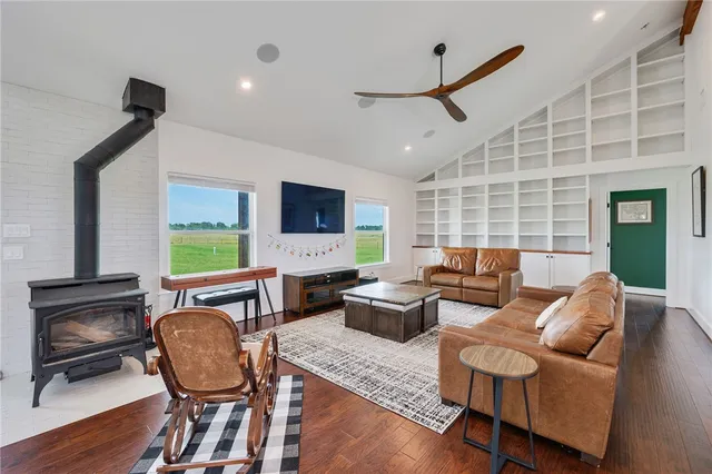 a living room with fireplace furniture and a flat screen tv