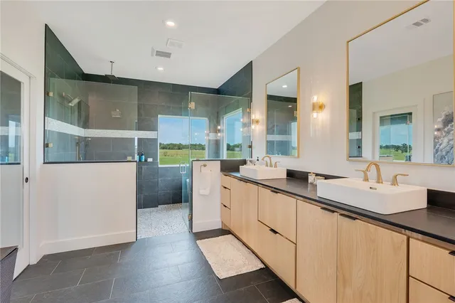 a large white kitchen with a large window