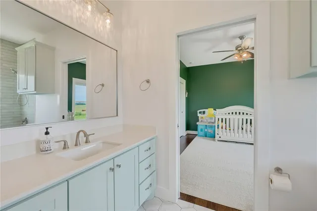 a bathroom with a sink and a mirror