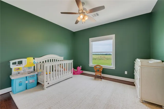 a bedroom with furniture and a window