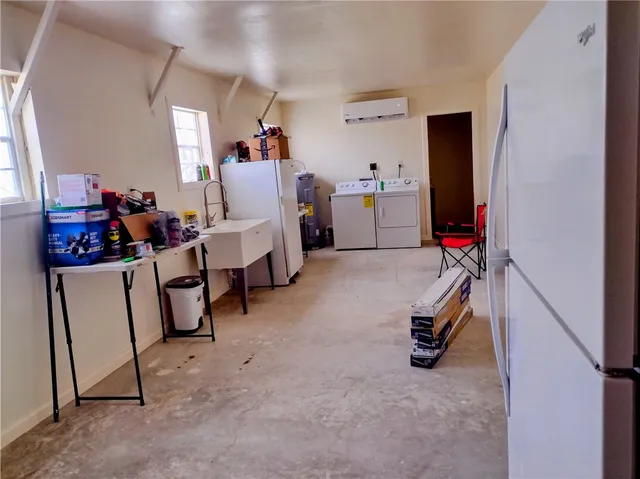 a view of a storage & utility room with closet window