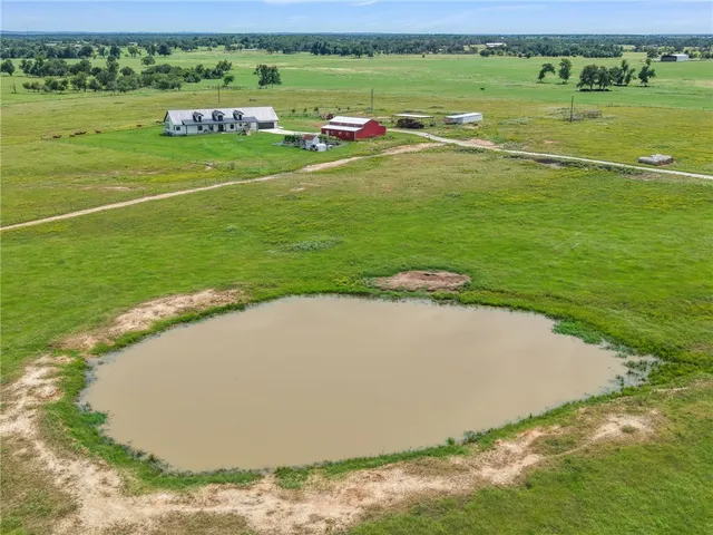 a view of a golf course with a ocean view