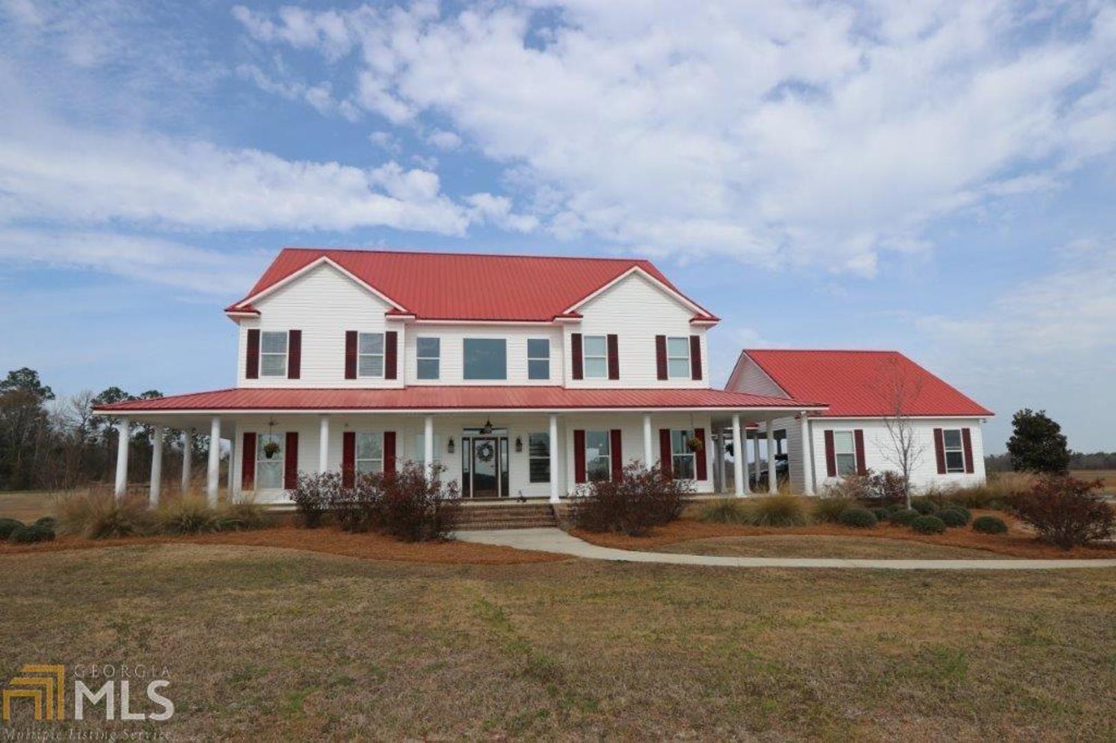 1209 Old Bowen Store Road Register, GA 30452 - Photo 1 of 1 a front view of a house with yard and balcony