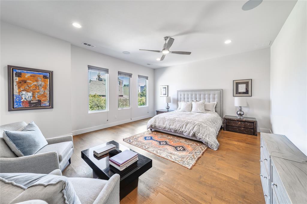 4144 Entrada Way Dallas, TX 75219 - Photo 17 of 34 a bedroom with a bed couches and window