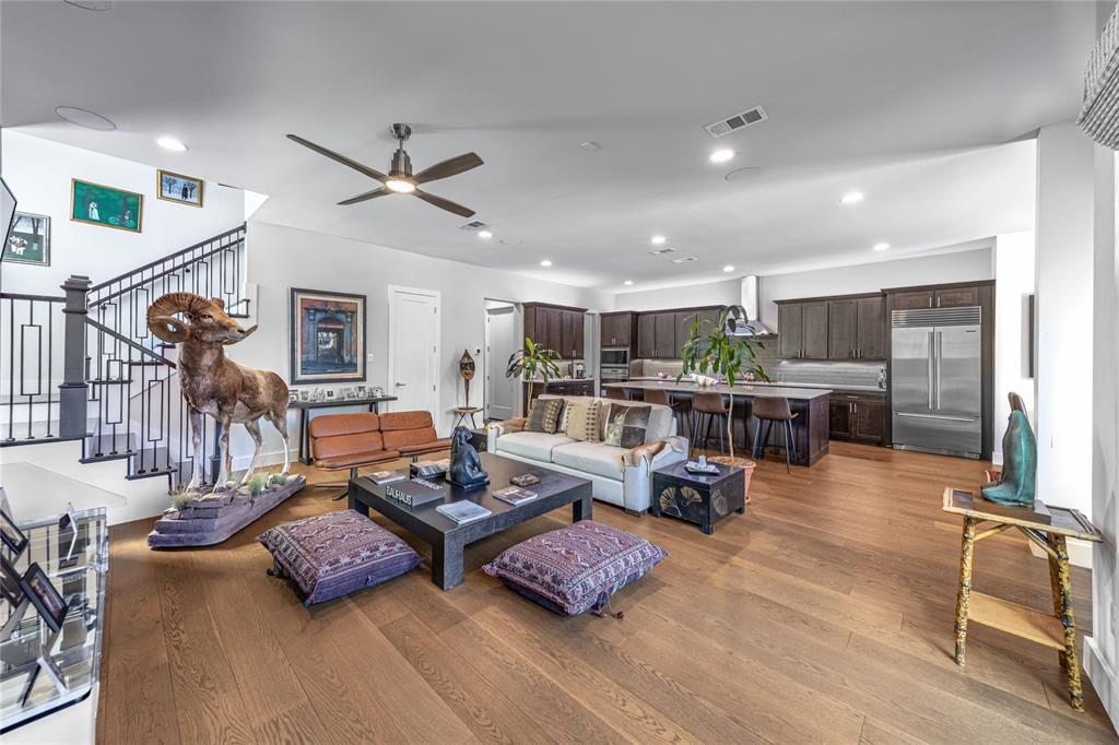 4144 Entrada Way Dallas, TX 75219 - Photo 2 of 34 a living room with furniture and kitchen view
