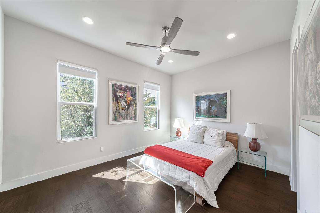 4144 Entrada Way Dallas, TX 75219 - Photo 22 of 34 a bedroom with a bed and a window