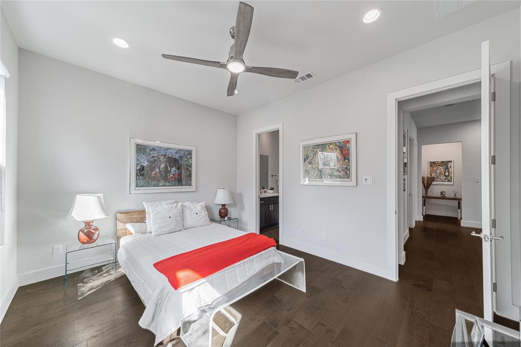 4144 Entrada Way Dallas, TX 75219 - Photo 23 of 34 a room with furniture and wooden floor