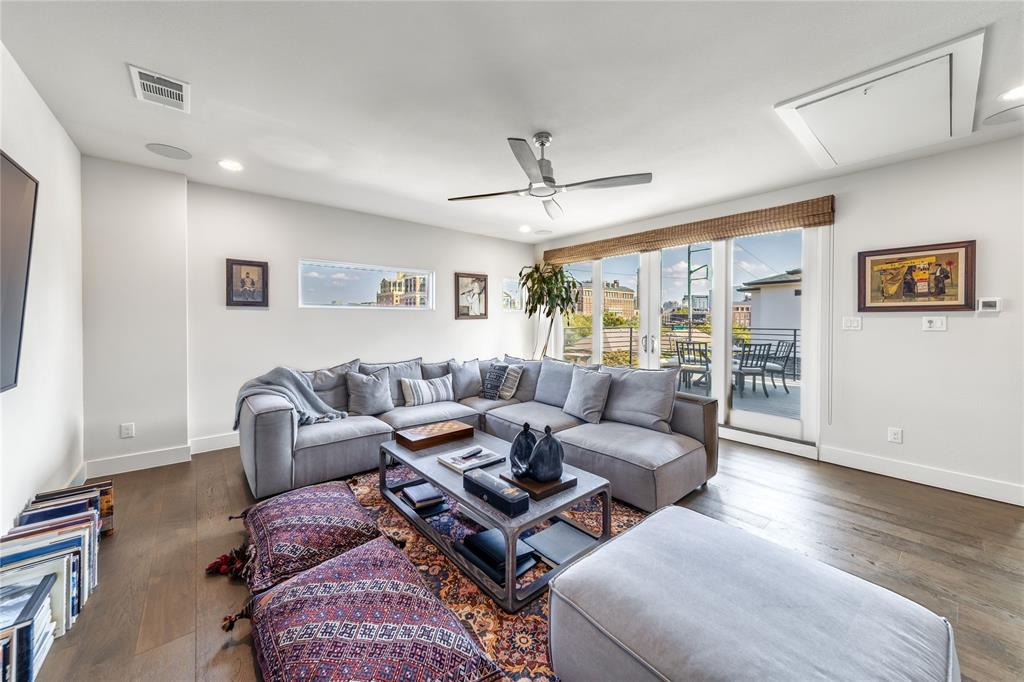 4144 Entrada Way Dallas, TX 75219 - Photo 29 of 34 a living room with furniture and a large window