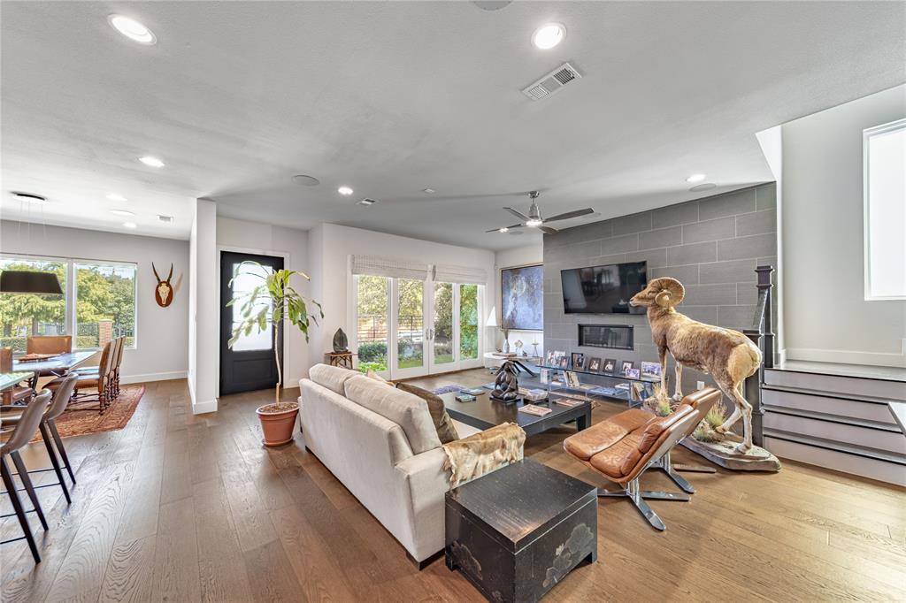4144 Entrada Way Dallas, TX 75219 - Photo 4 of 34 a living room with furniture and a wooden floor