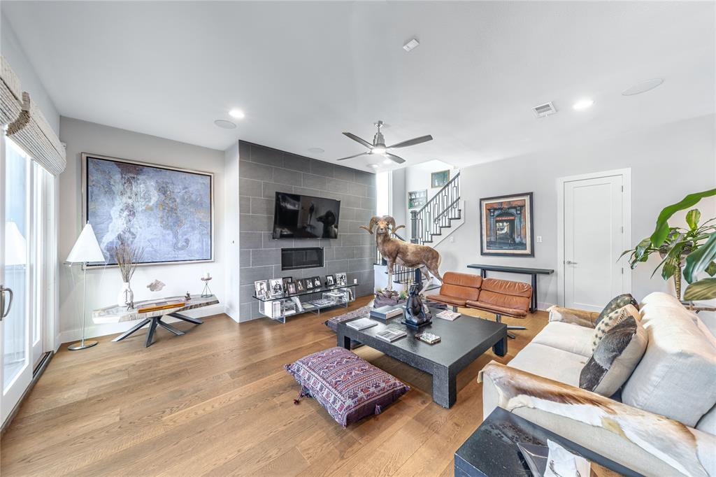 4144 Entrada Way Dallas, TX 75219 - Photo 5 of 34 a living room with furniture and a flat screen tv