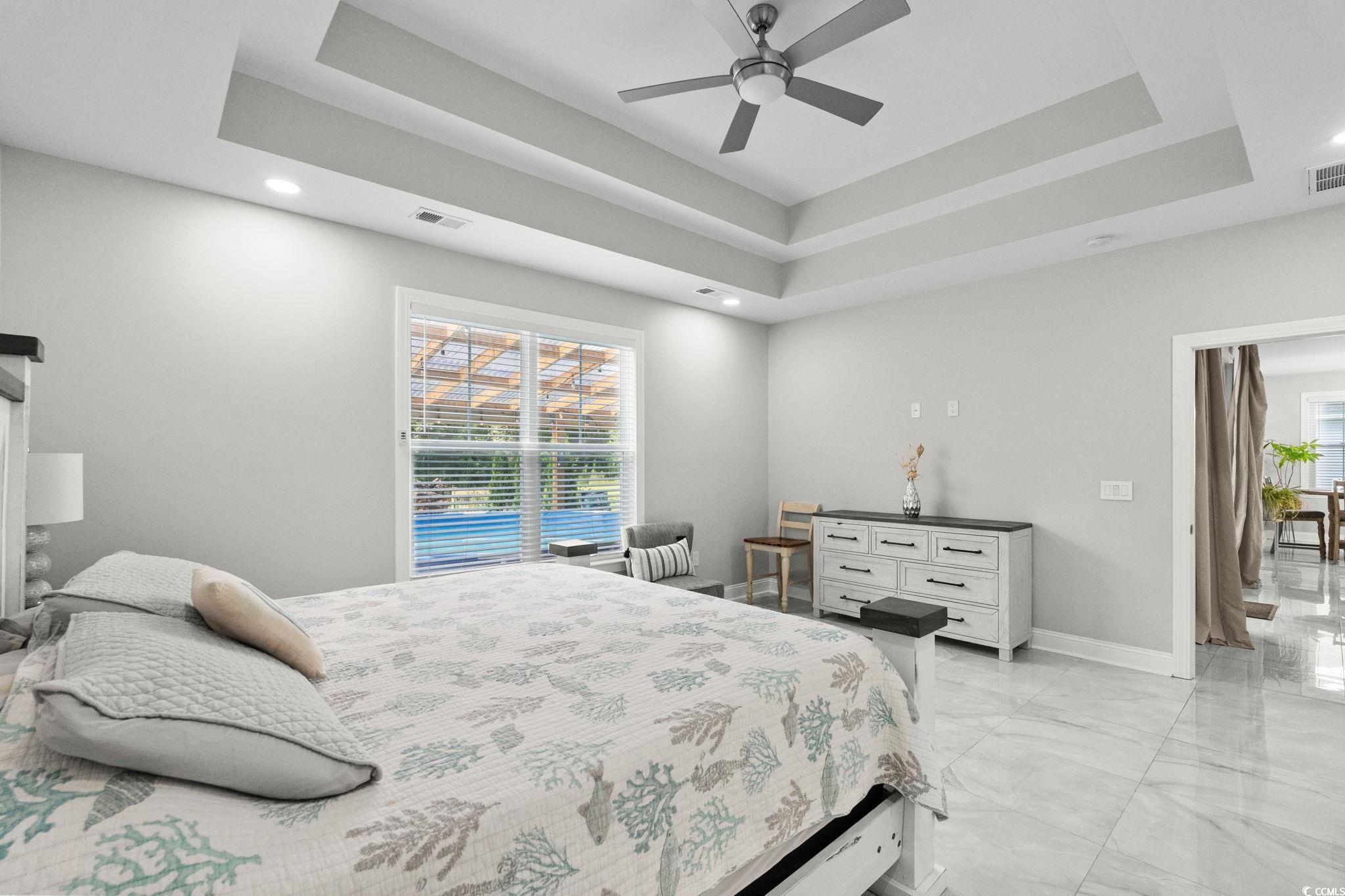 2133 Carries Lane Road Longs, SC 29568 - Photo 19 of 40 Bedroom with a tray ceiling, light marble finish flooring, ceiling fan, and recessed lighting