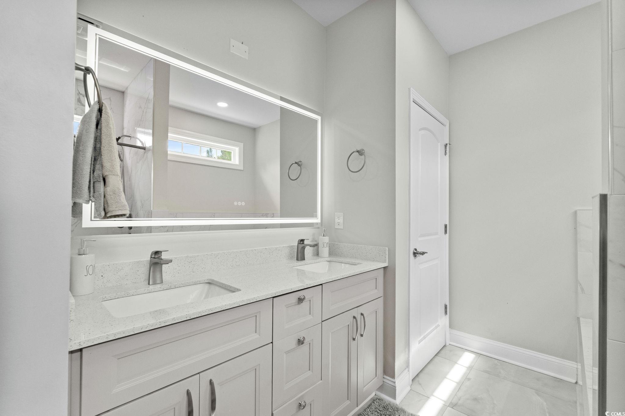 2133 Carries Lane Road Longs, SC 29568 - Photo 22 of 40 Full bathroom featuring double vanity and marble finish flooring