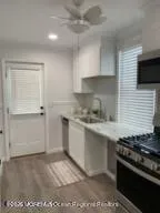 a kitchen with a stove and a sink