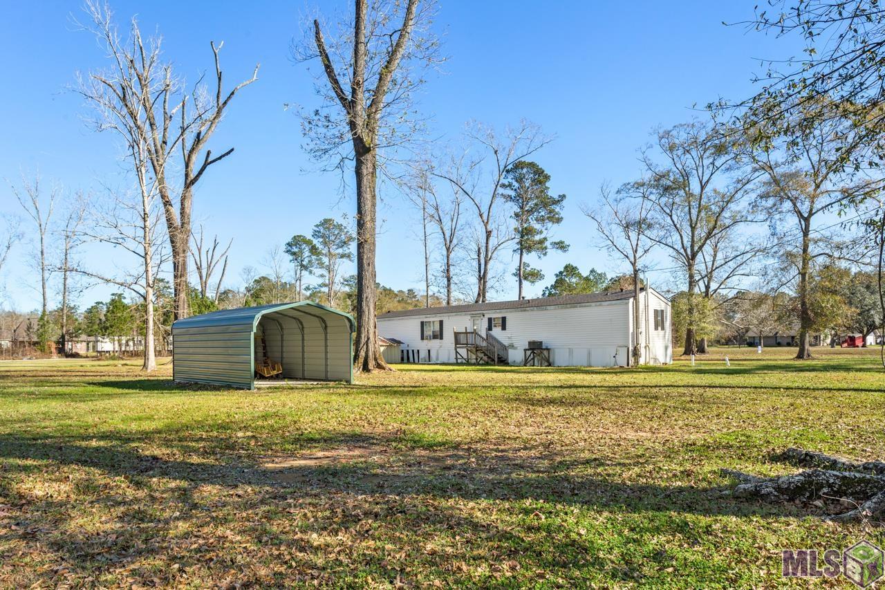 20’x12’ Metal Covered Boat / ATV Storage Area and an 8'x8' Storage Shed
