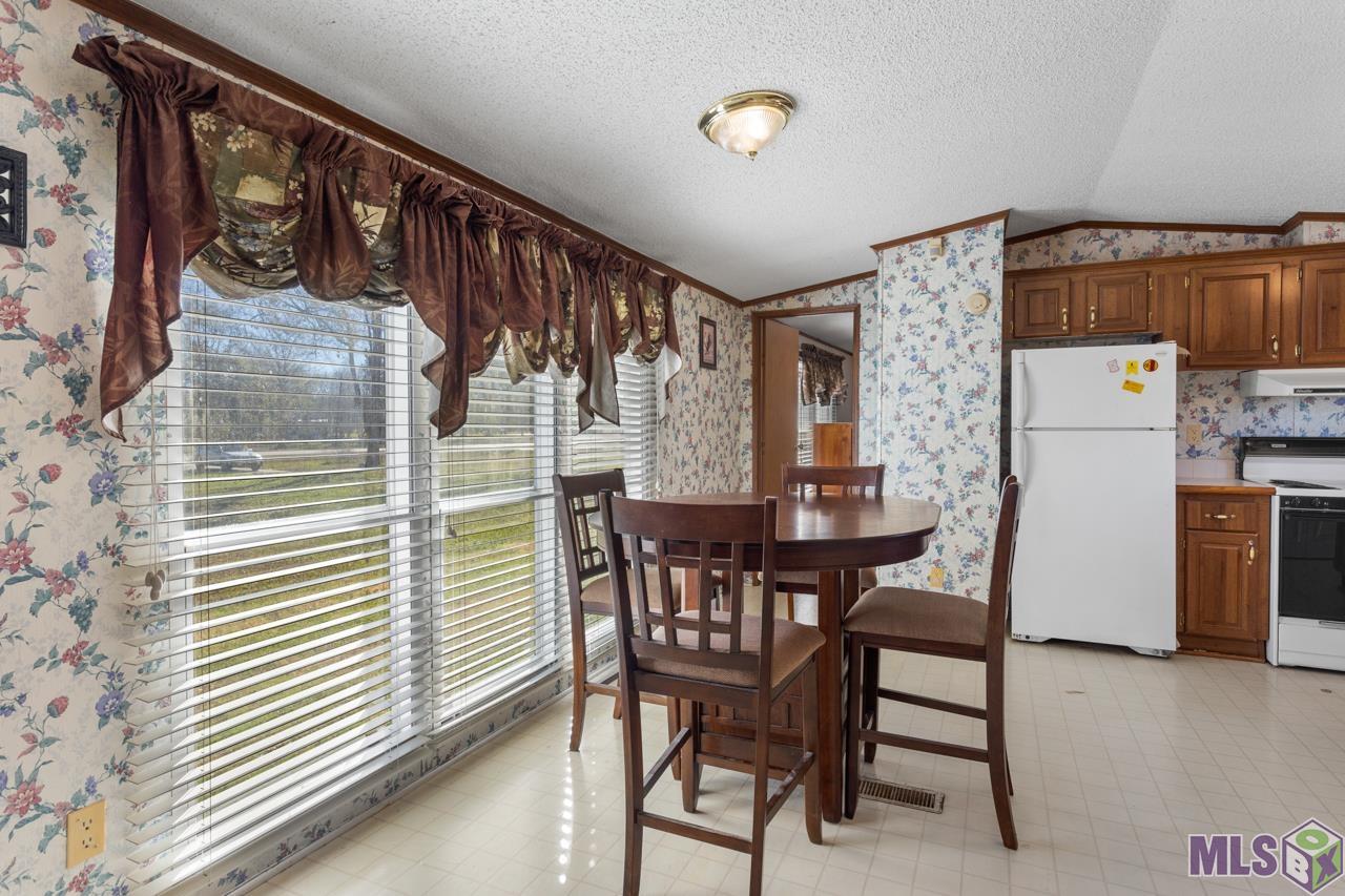 21149 Chaney Road Zachary, LA 70791 - Photo 9 of 13 Dining Room with Plenty of Natural Lighting