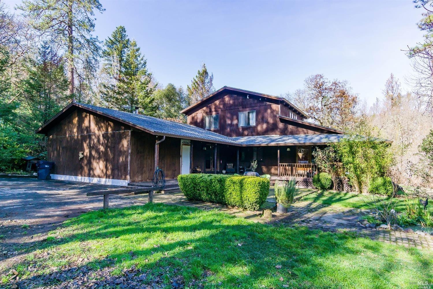 2304 Rancheria Road Redwood Valley, CA 95470 - Photo 1 of 1 a front view of a house with garden