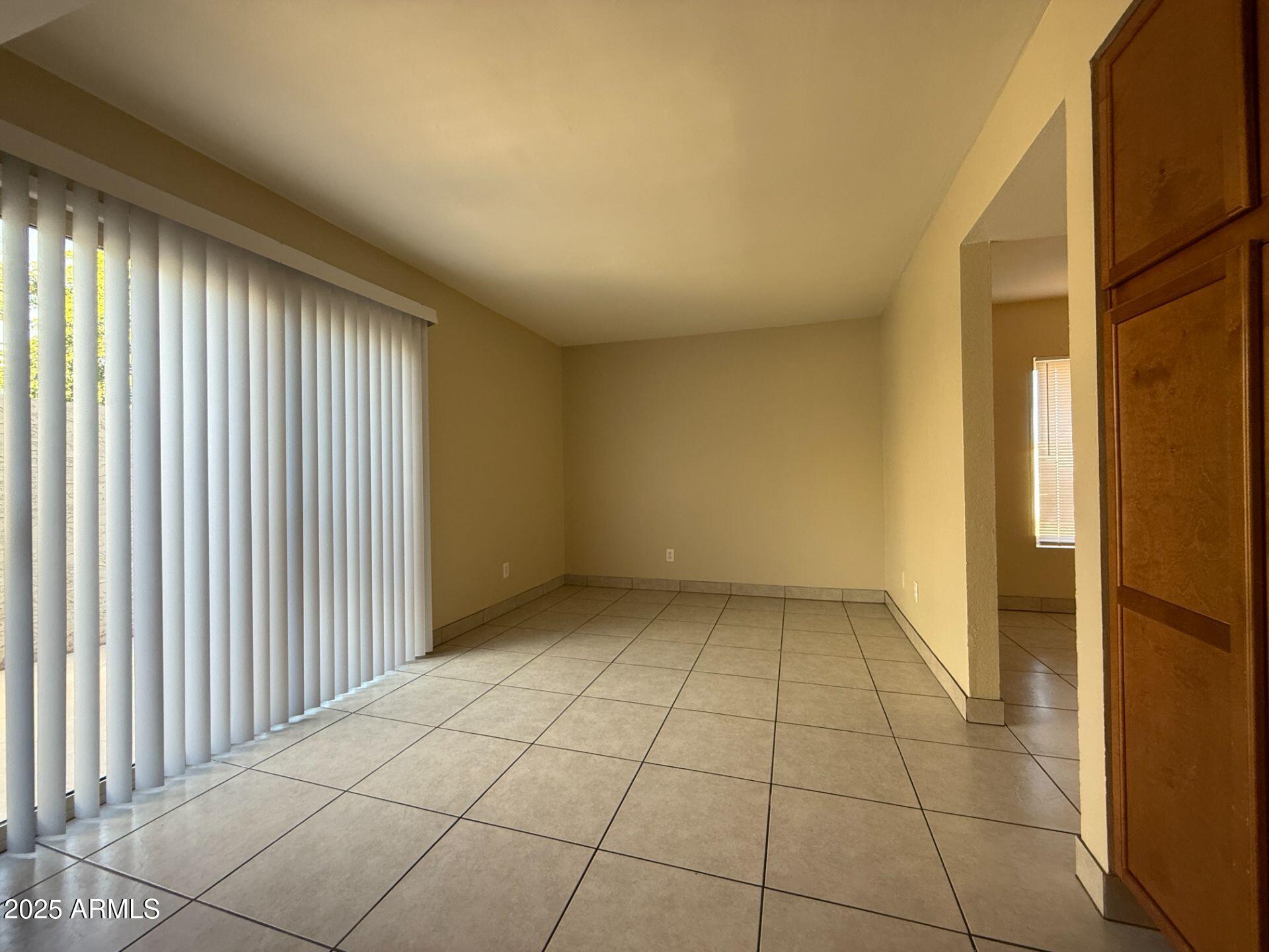 2415 West Greenway Road, Unit 3 Phoenix, AZ 85023 - Photo 12 of 36 a view of an empty room and window