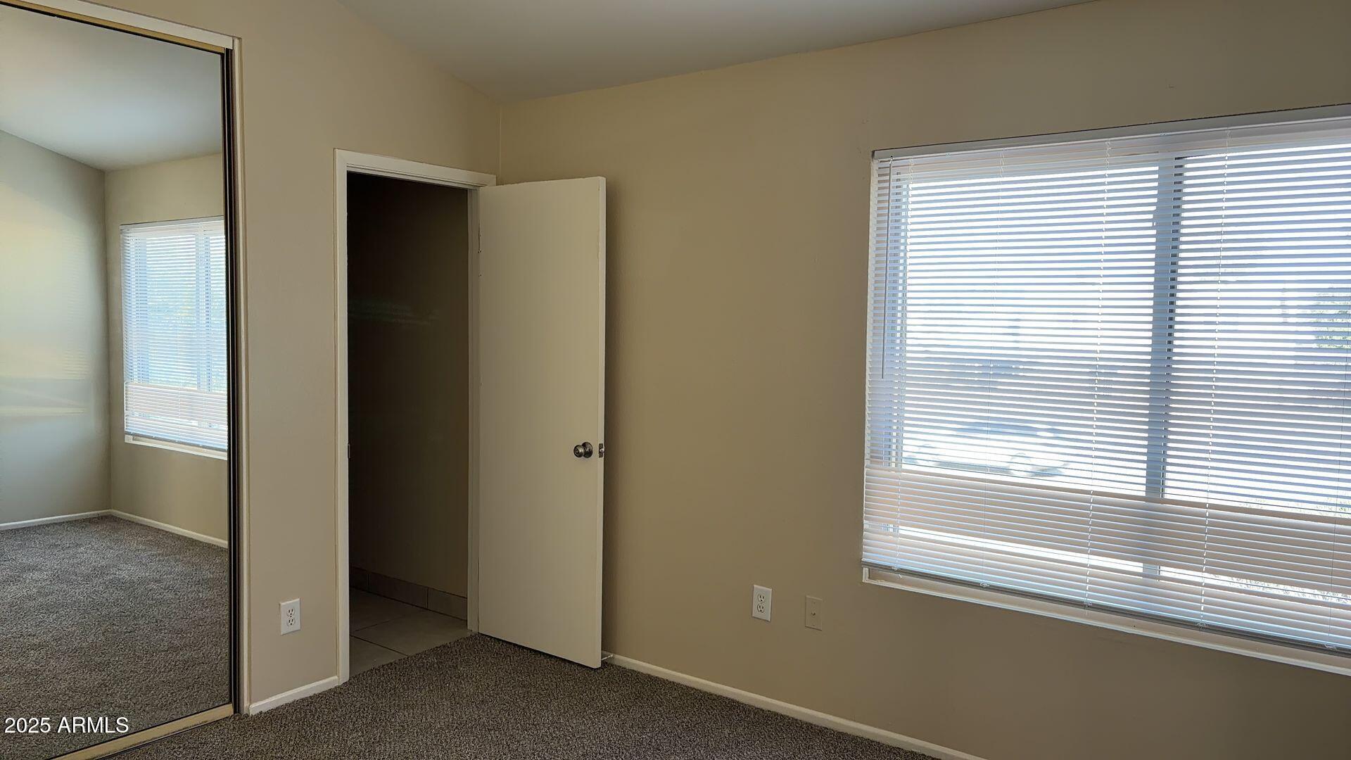 2415 West Greenway Road, Unit 3 Phoenix, AZ 85023 - Photo 15 of 36 a view of an empty room with a window