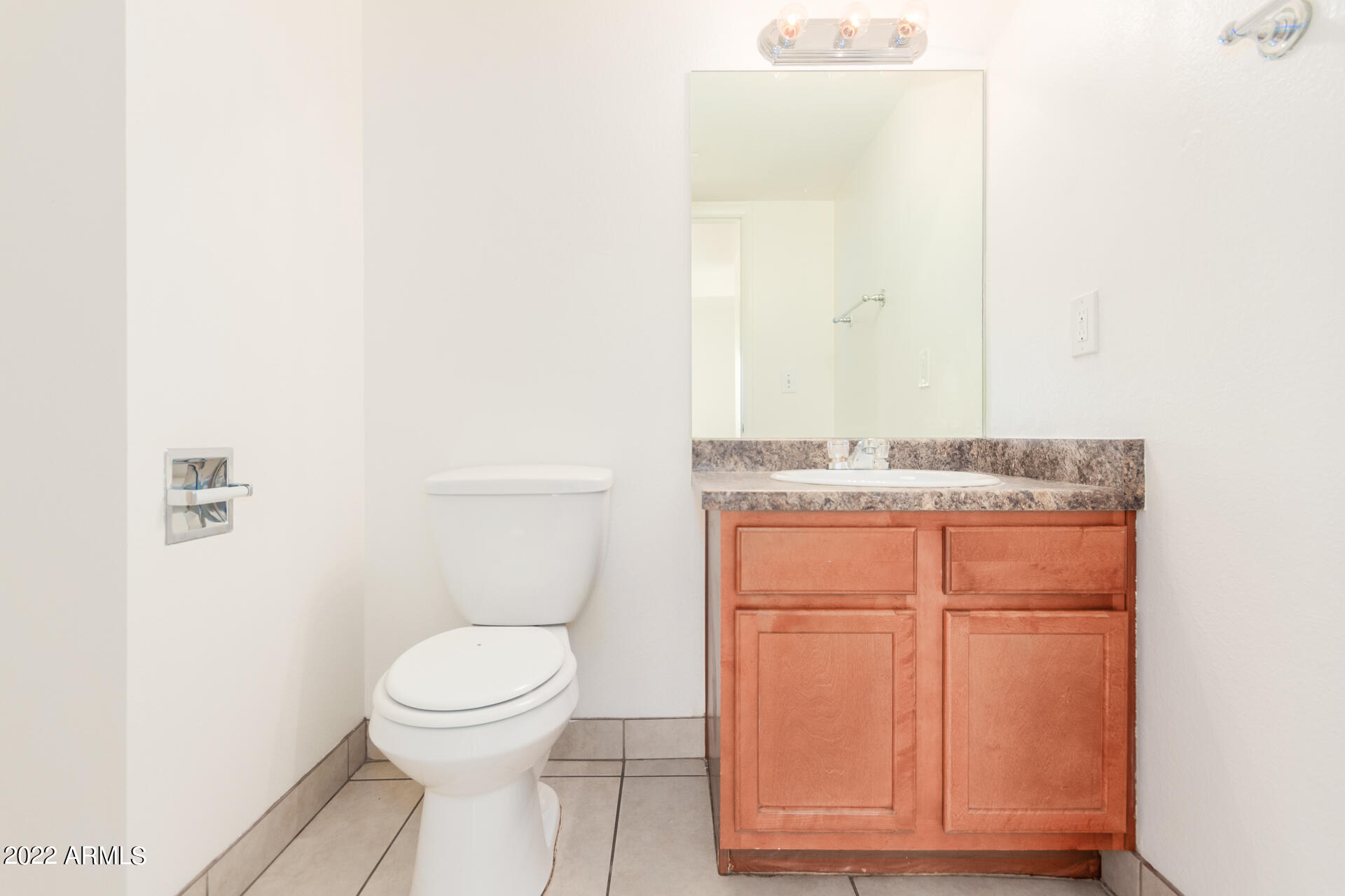 2415 West Greenway Road, Unit 3 Phoenix, AZ 85023 - Photo 19 of 36 a bathroom with a granite countertop toilet and a sink
