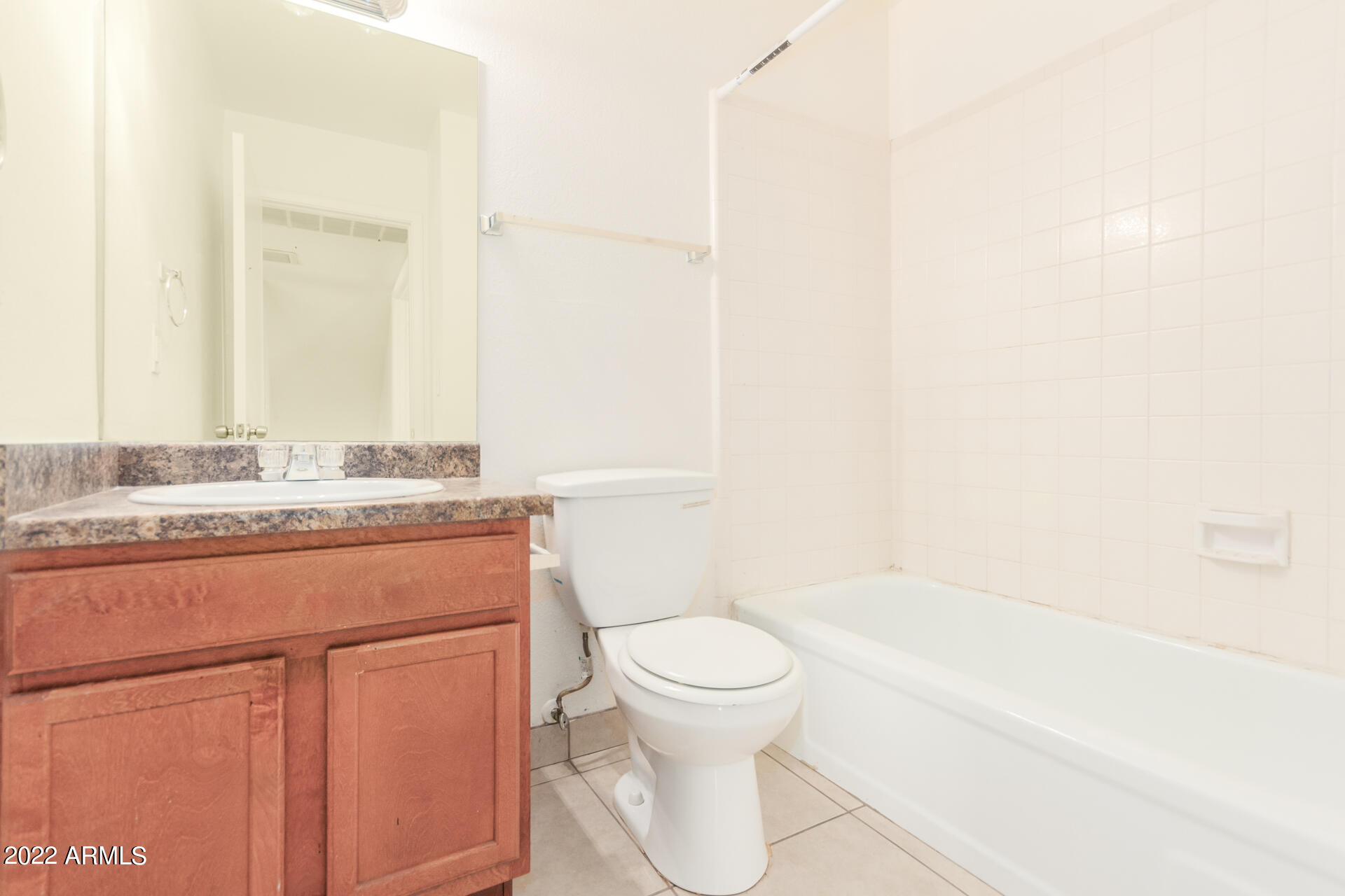 2415 West Greenway Road, Unit 3 Phoenix, AZ 85023 - Photo 21 of 36 a bathroom with a granite countertop sink a toilet and shower