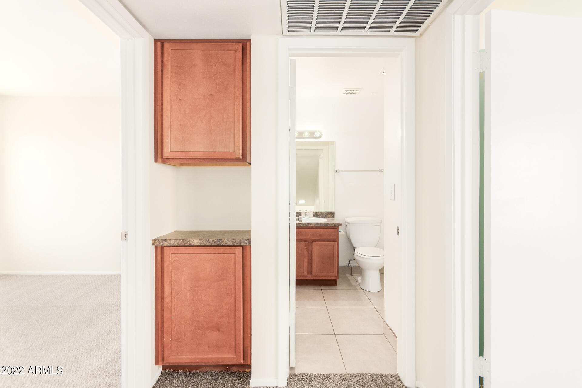 2415 West Greenway Road, Unit 3 Phoenix, AZ 85023 - Photo 22 of 36 a bathroom with a sink and a mirror