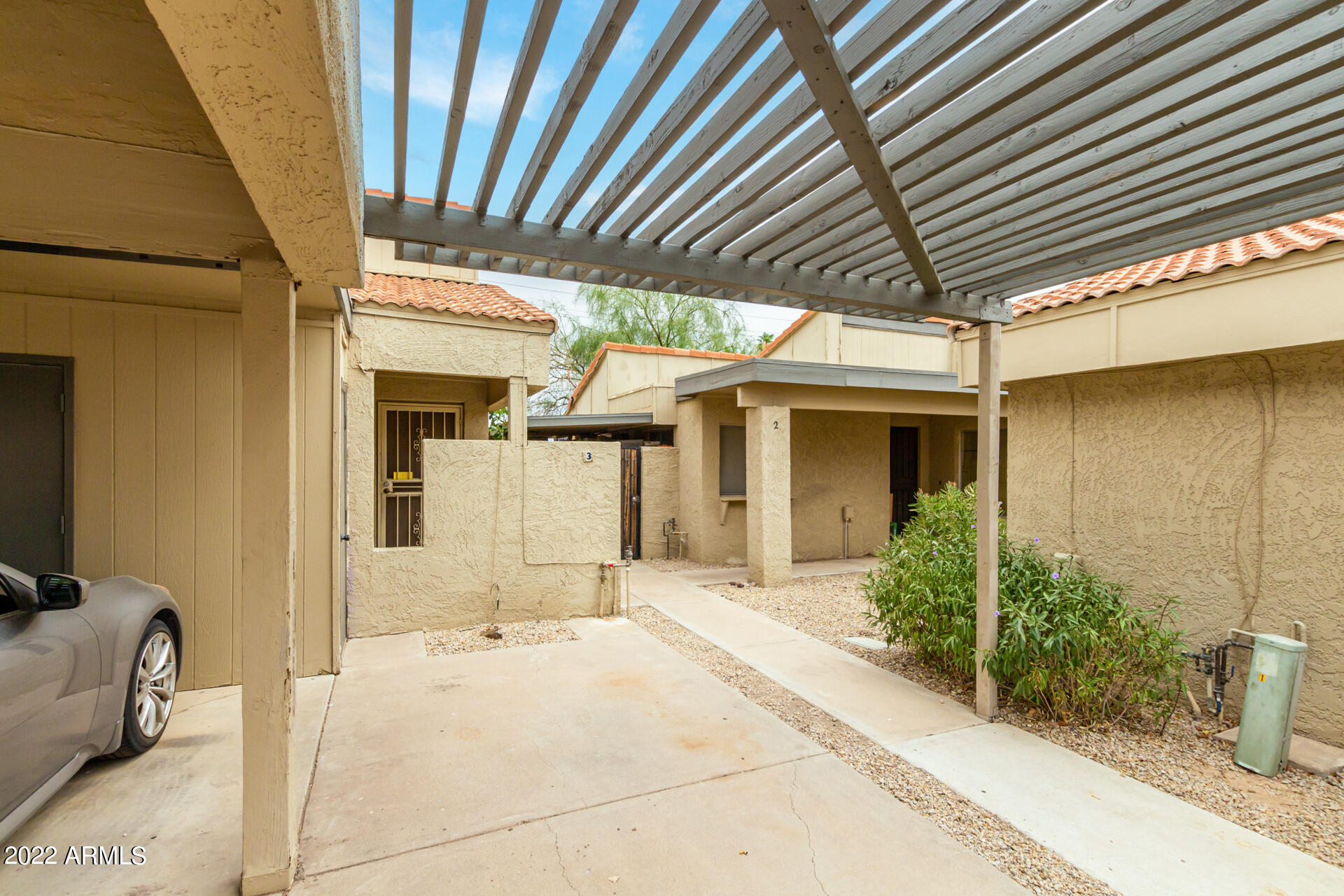 2415 West Greenway Road, Unit 3 Phoenix, AZ 85023 - Photo 3 of 36 a view of a porch with a table and chairs and potted plants
