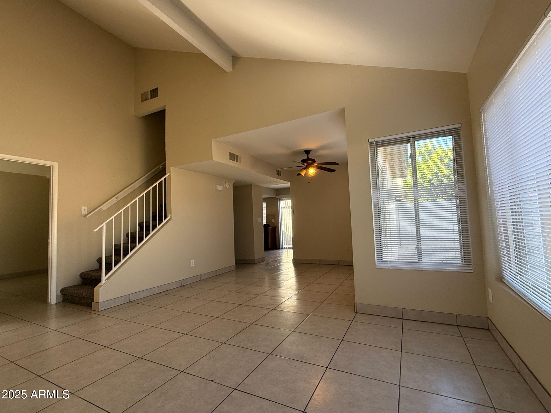 2415 West Greenway Road, Unit 3 Phoenix, AZ 85023 - Photo 4 of 36 a view of a hallway with windows and stairs