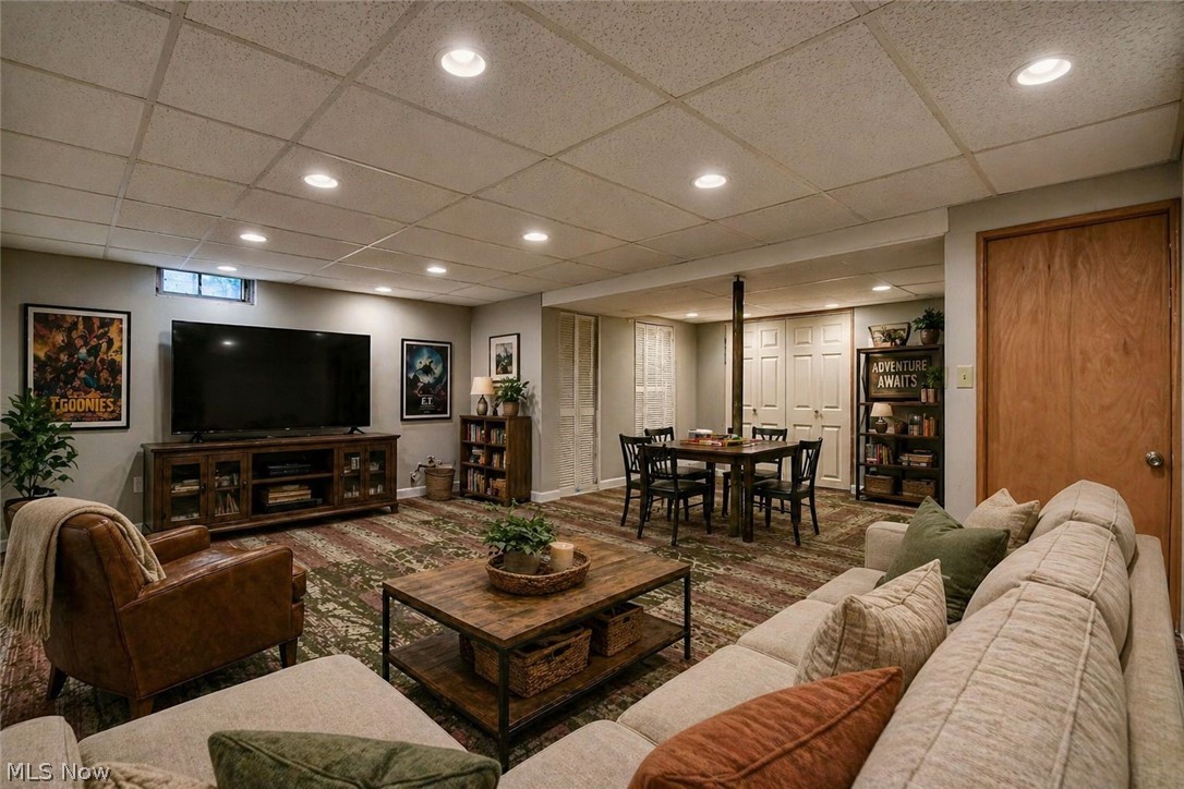 8242 Starburst Road Mentor, OH 44060 - Photo 16 of 37 Expansive lower-level living area with recessed lighting, paneled ceiling, and a distinct dining space