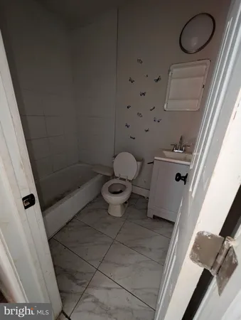 a view of a room with wooden floor and window