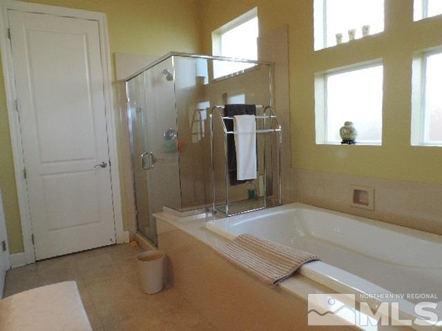 1065 Meridian Ranch Drive Reno, NV 89523 - Photo 11 of 25 a bathroom with a tub a sink and mirror