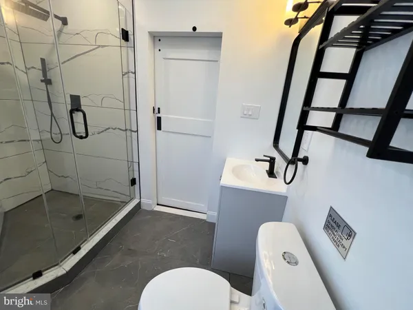 a bathroom with a shower and toilet