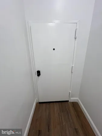 a view of a small space with wooden floor