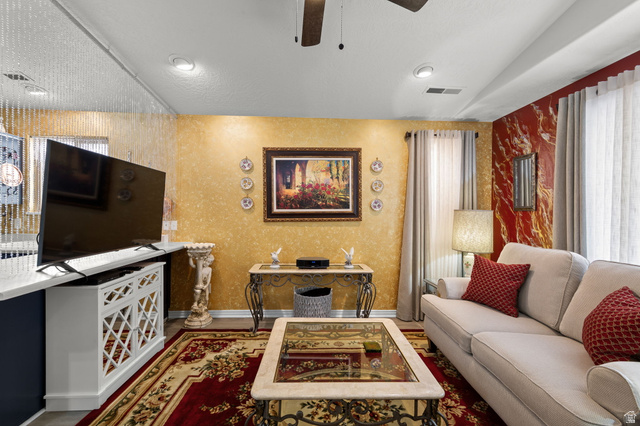 1225 North Dixie Downs Road, Unit 161 St. George, UT 84770 - Photo 4 of 21 Living area featuring recessed lighting, a ceiling fan, and decorative wall finishes