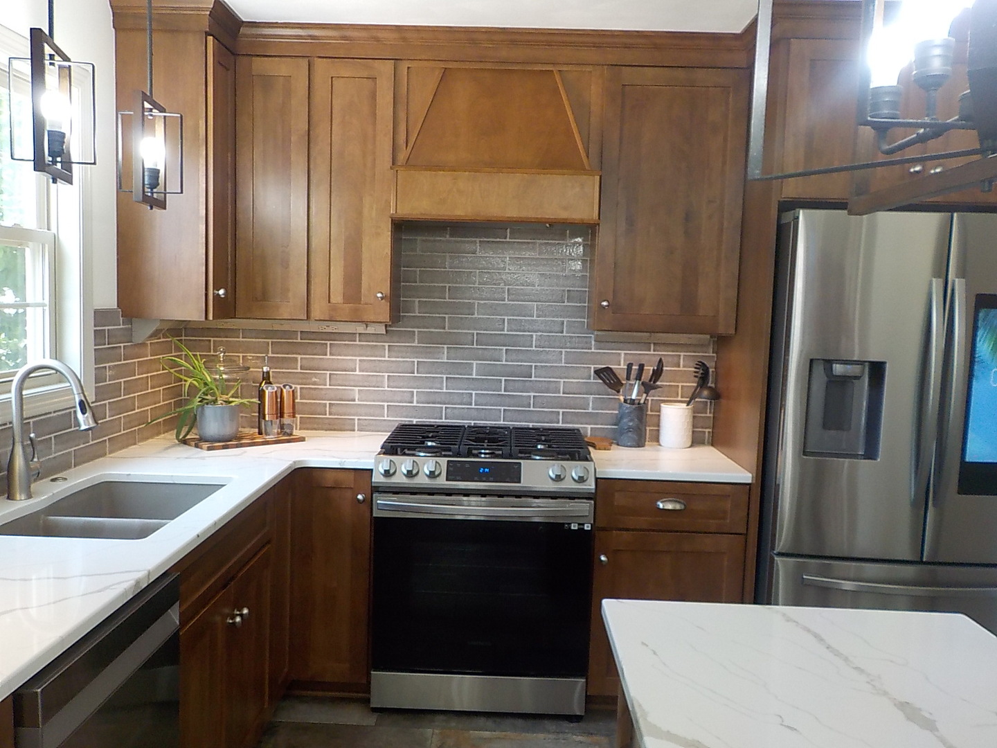 4412 Ridgeview Lane Byron, IL 61010 - Photo 12 of 35 a kitchen with a sink stove and refrigerator