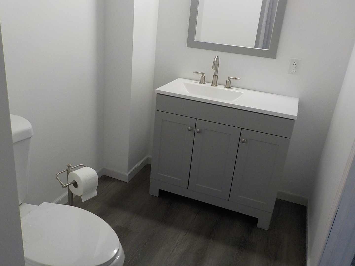 4412 Ridgeview Lane Byron, IL 61010 - Photo 33 of 35 a bathroom with a toilet sink and mirror