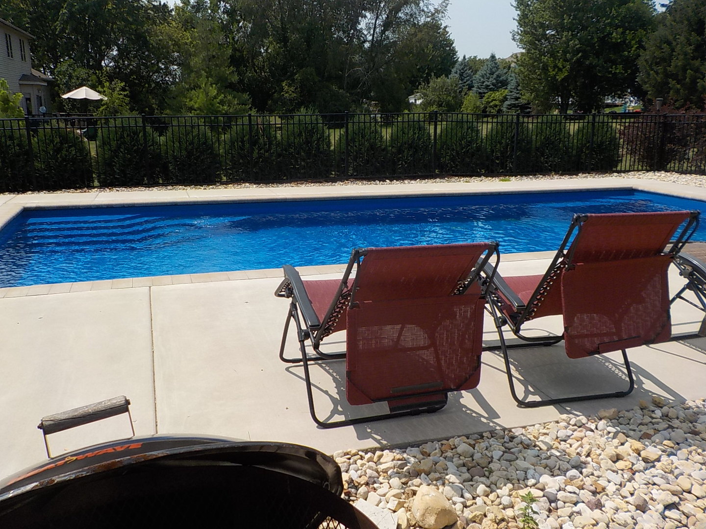 4412 Ridgeview Lane Byron, IL 61010 - Photo 4 of 35 a table and chairs sitting in the middle of a yard