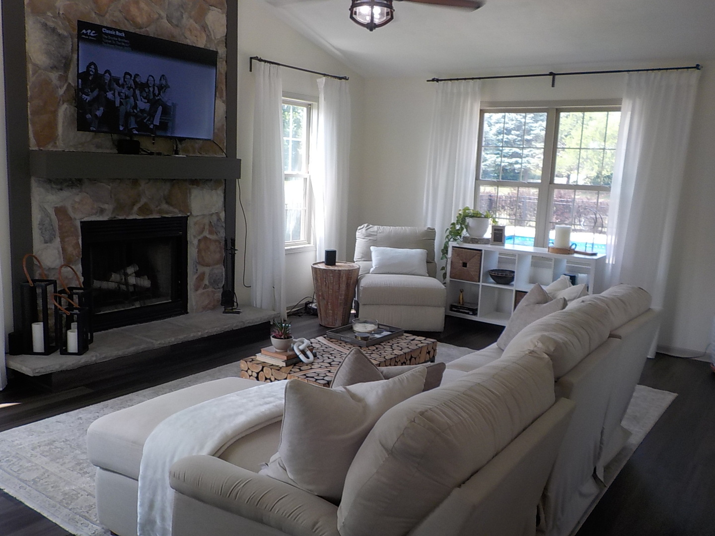 4412 Ridgeview Lane Byron, IL 61010 - Photo 9 of 35 a living room with furniture a large window and a fireplace