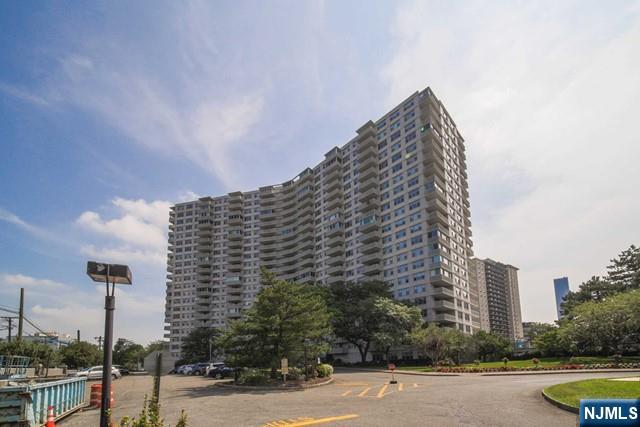 2100 Linwood Avenue, Unit 17T Fort Lee, NJ 07024 - Photo 1 of 17 a view of a large building next to a road