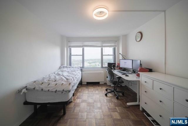 2100 Linwood Avenue, Unit 17T Fort Lee, NJ 07024 - Photo 11 of 17 a view of a workspace with furniture and a window