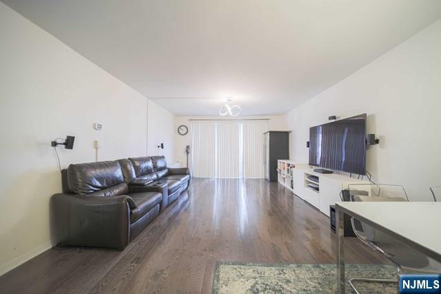 2100 Linwood Avenue, Unit 17T Fort Lee, NJ 07024 - Photo 3 of 17 a living room with furniture and a flat screen tv