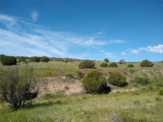 a view of an ocean and a yard